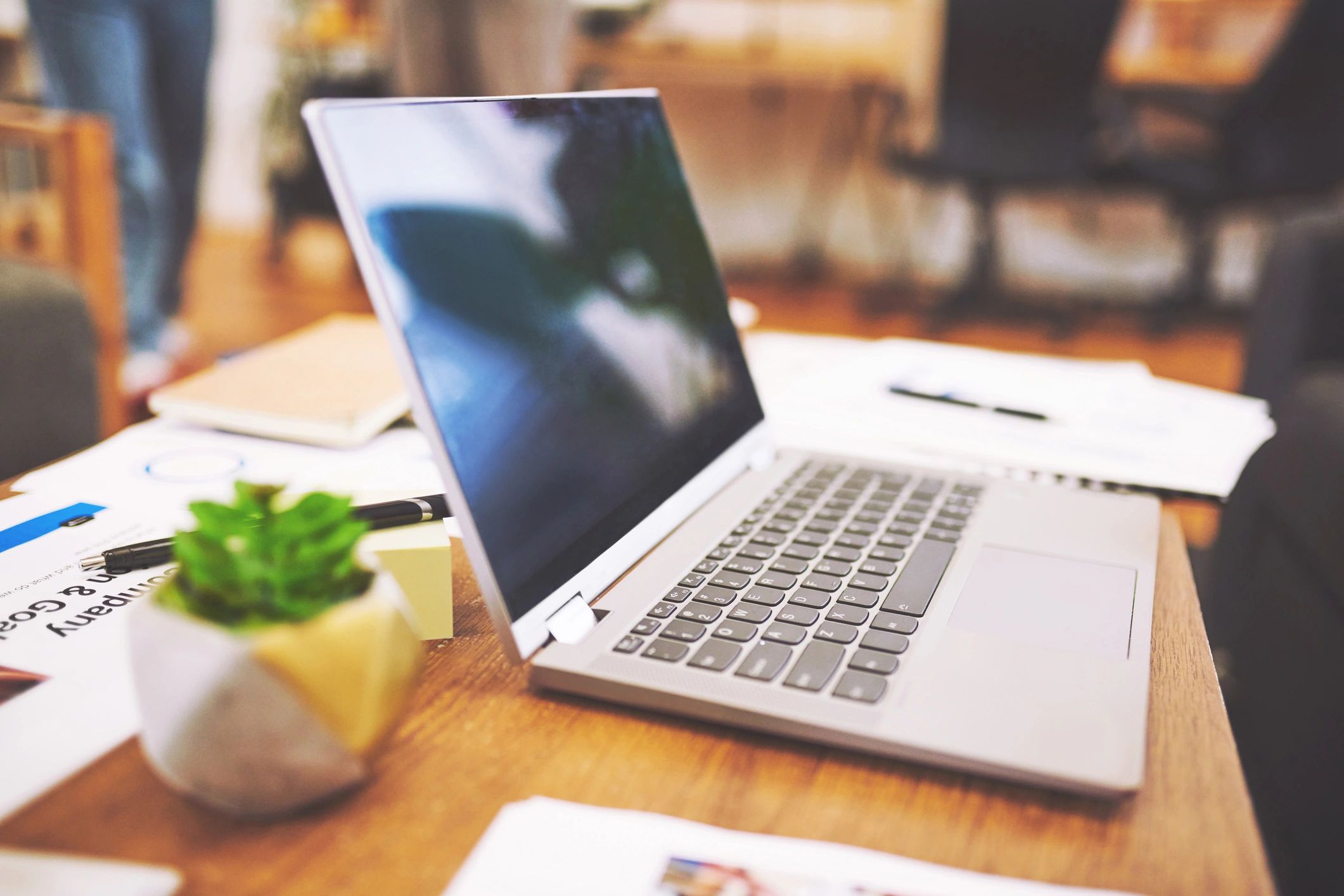 Notebook and laptop on a desk for career planning